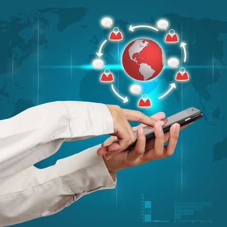 Modern mobile phone in a  businessman hand. Communications of digital business.の写真素材