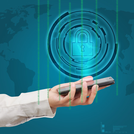 Business hand show a smartphone security concept.の写真素材