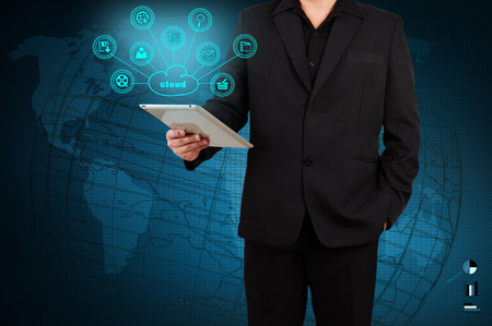 Businessman showing a tablet with cloud computingの写真素材