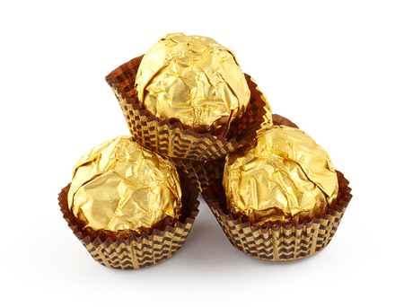 chocolate truffles in sparkling paper capsの写真素材