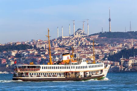 ferryboat sails along Bosphorus passing famous Construction of Camlica Mosque, Camlica Hill, Istanbul, Turkeyのeditorial素材