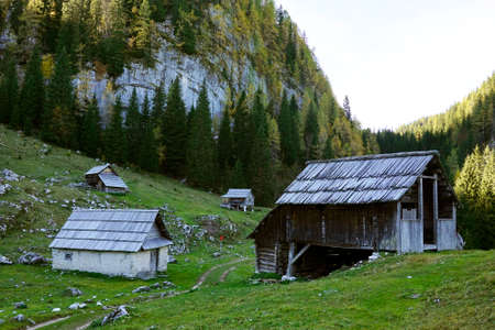 Traditional alpine huts and wooden cattle stables on Swiss pastures, Nesslau - Obertoggenburg, Switzerland (Schweiz)の写真素材
