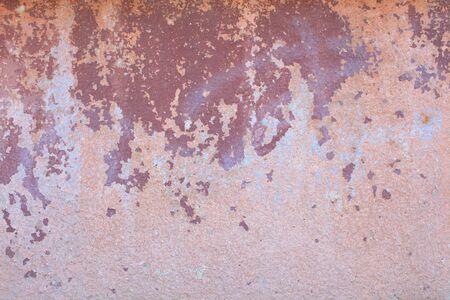 Old pink wall with red spots of paint