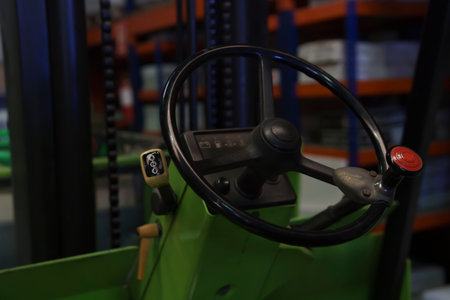 Close-up of the steering wheel of a forklift machine