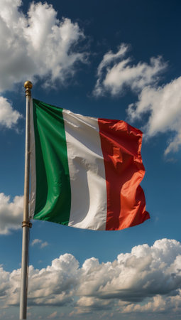 A flag with the colors green, white and red flies in the sky. Italyの素材