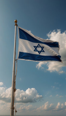 A blue and white flag with a star flies in the sky. Israelの素材