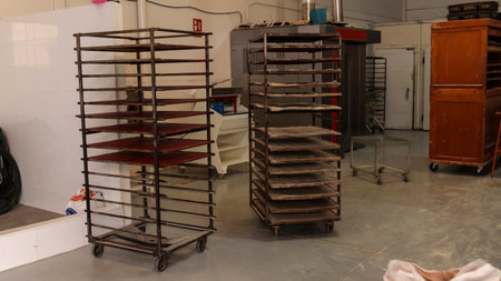 Empty bakery racks in an industrial baking facilityの写真素材
