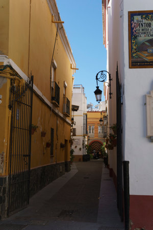 Sunny Afternoon in Quaint European Alley with Historical Architectureの写真素材