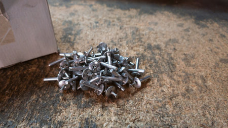Blind rivets on a table in the workshop or warehouseの写真素材