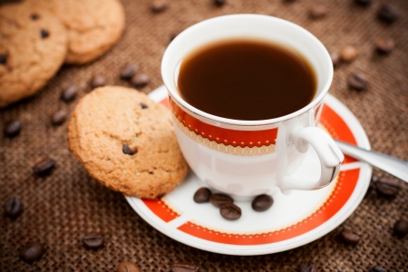 Photo of a cup of coffee with cookiesの写真素材