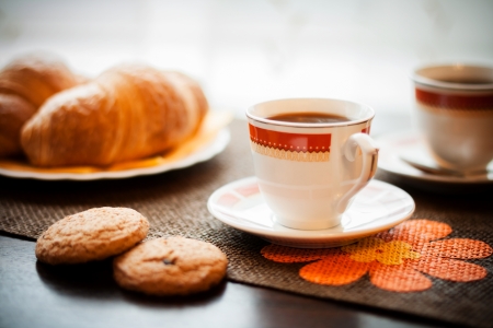Photo with the image of a cup of coffee and confectionery productsの写真素材
