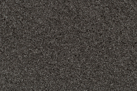 Photo of a background of black foam rubberの写真素材