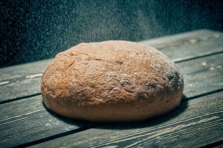 Fresh round bread on the bakery tableの写真素材
