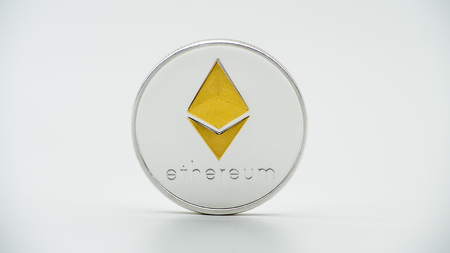 Physical metal silver Ethereum currency on white background. New worldwide virtual internet money. Digital Etherum coin cyberspace, cryptocurrency ETH. Good investment future of online paymentの写真素材