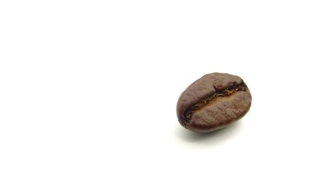 Close up of a roasted coffee bean on white backgroundの写真素材