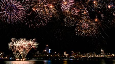A beautiful Fireworks light up the sky with dazzling display on dark background at taipei city to...