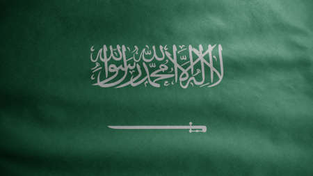 Kingdom Saudi Arabia flag waving in the wind. Close up of KSA banner blowing, soft and smooth silk. Cloth fabric texture ensign background. Use it for national day and country occasions concept.の写真素材