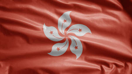 Hongkong flag waving in the wind. Close up of Hong Kong banner blowing, soft and smooth silk. Cloth fabric texture ensign background. Use it for national day and country occasions concept.の写真素材