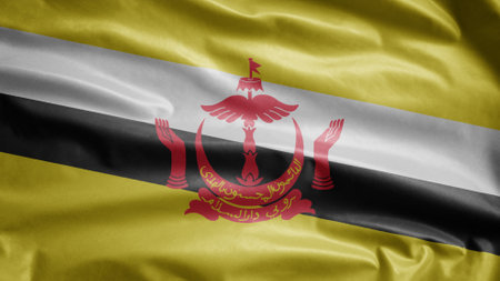 Bruneian flag waving in the wind. Close up of Brunei banner blowing, soft and smooth silk. Cloth fabric texture ensign background. Use it for national day and country occasions concept.の写真素材