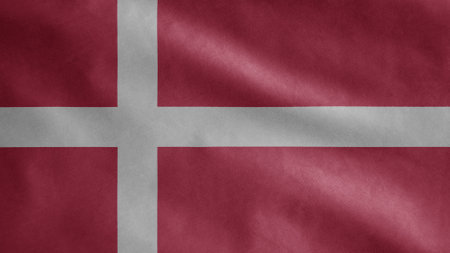Danish flag waving in the wind. Close up of Denmark banner blowing, soft and smooth silk. Cloth fabric texture ensign background. Use it for national day and country occasions concept.の写真素材