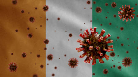 3D, Ivoria flag waving with coronavirus outbreak infecting respiratory system as dangerous flu. Influenza type Covid 19 virus with national Ivory Coast banner blowing background. Pandemic risk conceptの写真素材