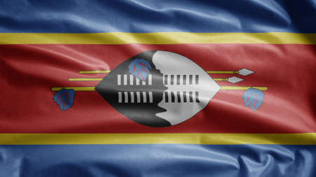 Swaziland flag waving in the wind. Close up of Eswatini banner blowing, soft and smooth silk. Cloth fabric texture ensign background. Use it for national day and country occasions concept.の写真素材