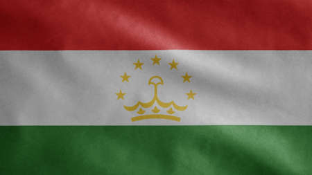 Tajikistani flag waving in the wind. Close up of Tajikistan banner blowing, soft and smooth silk. Cloth fabric texture ensign background.の写真素材