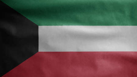 Kuwaiti flag waving in the wind. Close up of Kuwait banner blowing, soft and smooth silk. Cloth fabric texture ensign background. Use it for national day and country occasions concept.の写真素材