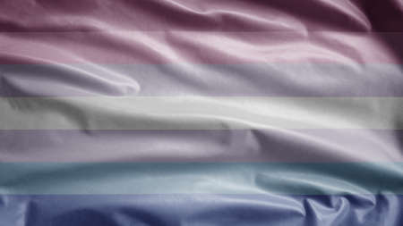 Gender binary flag waving in the wind. Close up of binarism banner blowing, soft and smooth silk. Cloth fabric texture ensign background.の写真素材