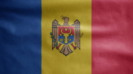 Moldovan flag waving in the wind. Close up of Moldova banner blowing, soft and smooth silk. Cloth fabric texture ensign background.の写真素材