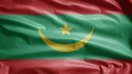 Mauritanian flag waving in the wind. Close up of Mauritania banner blowing, soft and smooth silk. Cloth fabric texture ensign background. Use it for national day and country occasions concept.の写真素材