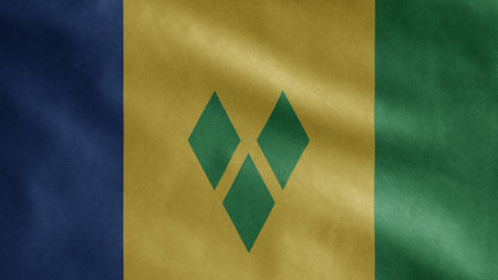Vincentian flag waving in the wind. Close up of Saint Vincent and Grenadines banner blowing, soft and smooth silk. Cloth fabric texture ensign background.の写真素材