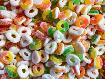 Assorted gummy candies and jellies as background. A lot of colorful jelly sweets candy flavor. Top...