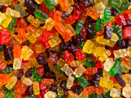 Delicious jelly bears. Closeup a background from colorful sweets of sugar candies. Assortment tasty...