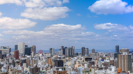 Aerial view of Osaka city from sky building. Bird eye view of cityscape with crowded skyscrapers offices and apartments. Panorama urban rooftop view from the skyline at Japan districtのeditorial素材