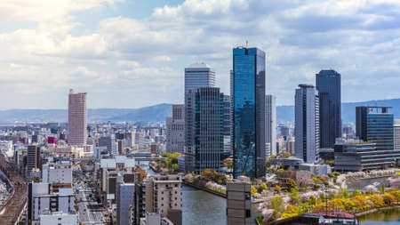 Aerial view of Osaka city from sky building. Bird eye view of cityscape with crowded skyscrapers offices and apartments. Panorama urban rooftop view from the skyline at Japan districtのeditorial素材