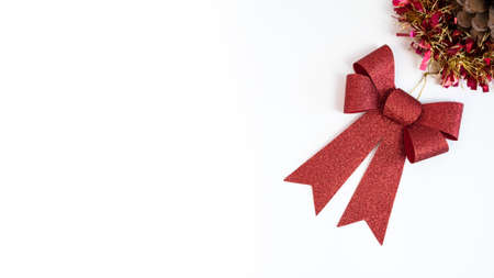 Beautiful red bow gift christmas decoration isolated at border on white background. Xmas ornaments with copy space for text. New year realistic decor design element for celebrate card or flyerの写真素材