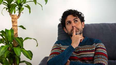 Handsome male model feels concerned puzzled lost in thoughts pondering making decision concept. Man...