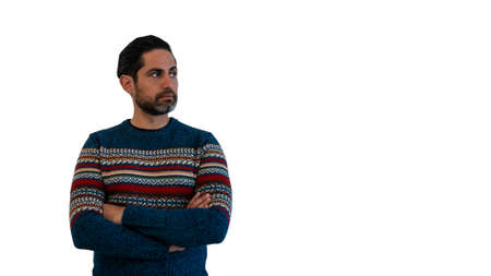 Portrait of cool and handsome man wearing a winter sweater and looking to copy space aside for your promotional text or advertisement on white studio backgroundの写真素材