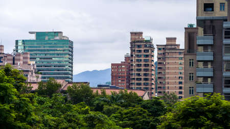 Aerial view of corporate landmark skyline and forest park in modern city Taiwanの写真素材