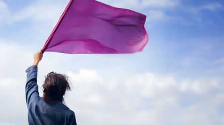 A female protestor takes to the street, her purple flag making a powerful statement in the fight for gender equality with empty copy space for text. The feminist movement empowerment. Generative AI.の素材