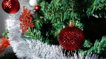 Green pine branch with Christmas balls and copy space for text. View of fir tree branches and Xmas baubles for decoration banner and New Year concept.の写真素材