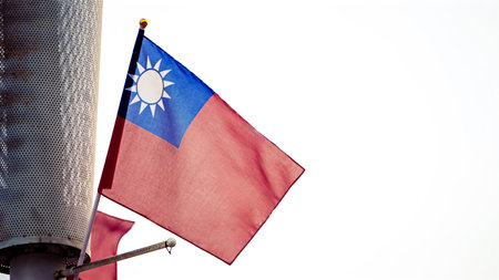 Taiwan flag blowing in the wind with empty copy space for text. Perfect for themes of freedom, culture, and national pride.の写真素材