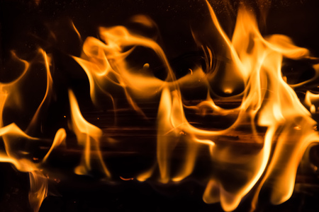 Yellow fire burning woodの写真素材