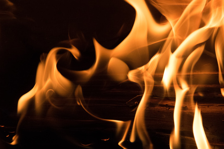 Yellow fire burning woodの写真素材