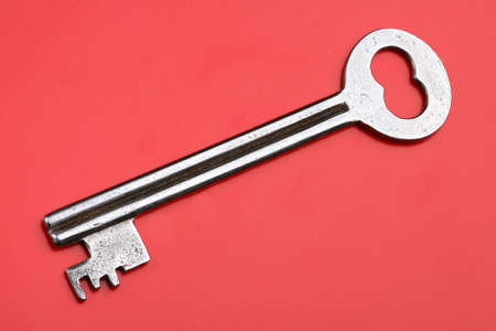Old Key on red background.の写真素材