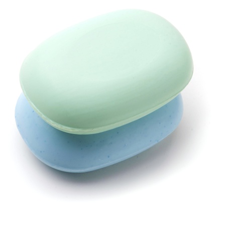 Towel and Stack of new Soap Bars on white background の写真素材