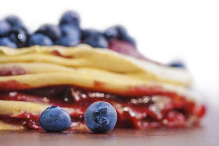 Stack of homemade pancakes with fresh blueberries. Soft focus view.の写真素材