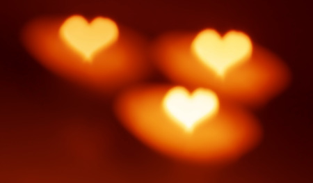Heart shape, bokeh style, candles. Abstract love blurred background. Good mood.の写真素材