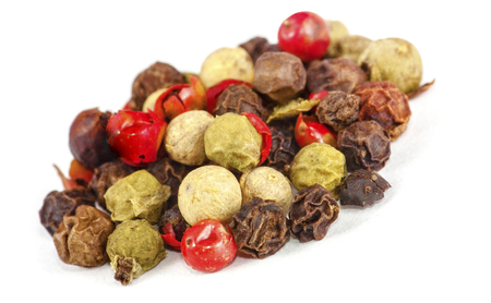Dried seeds of color pepper. Soft focus. Isolated on white background.の写真素材